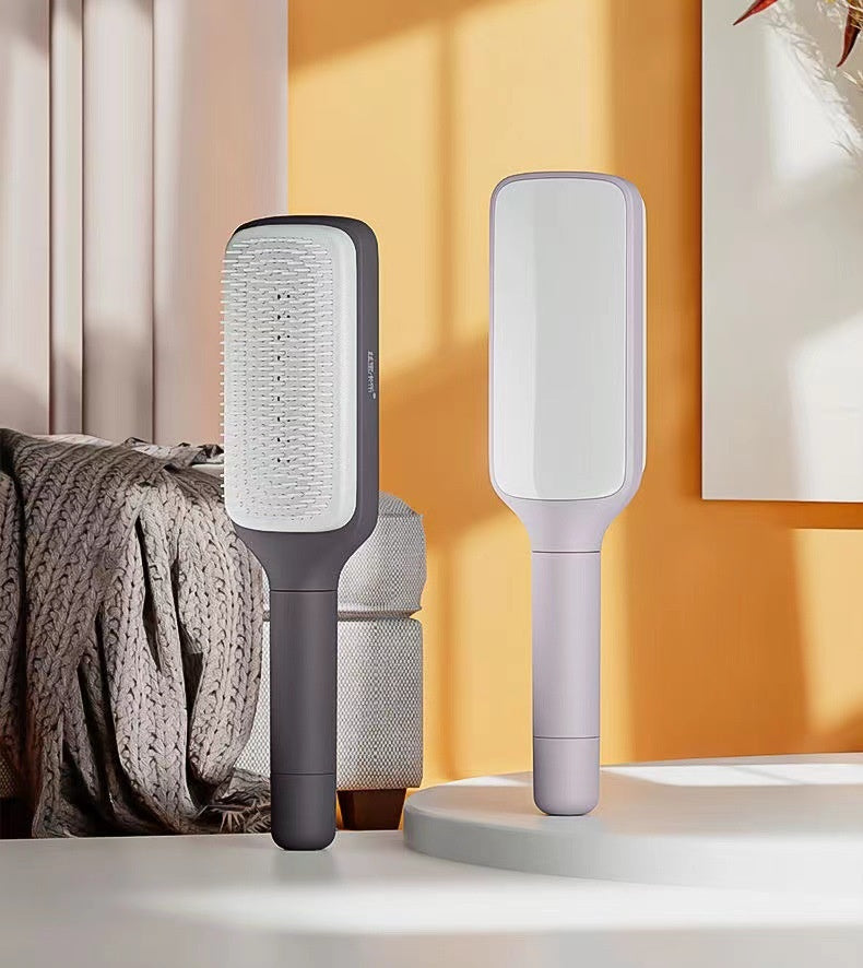 GlydeBrush™ self-cleaning hairbrush — twist-release mechanism
